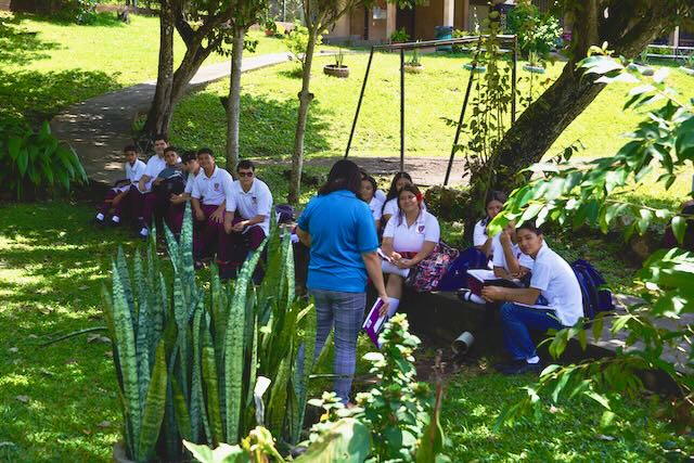 Class meeting outside at the school.